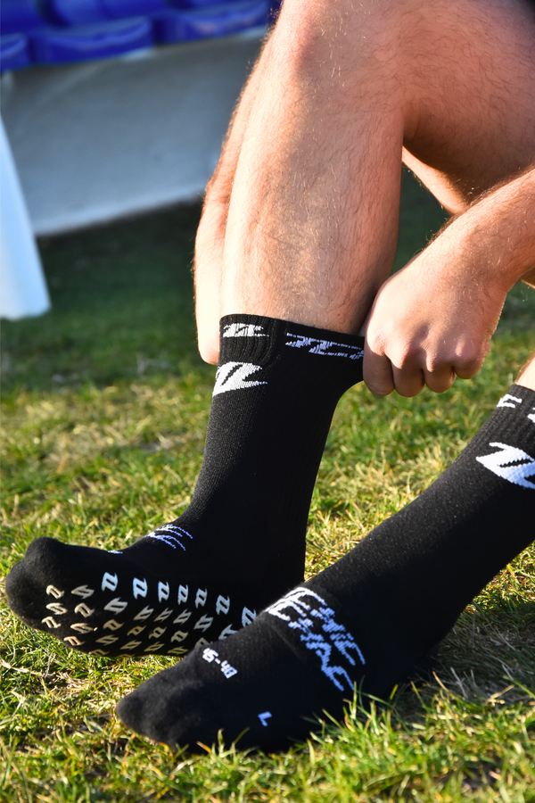 Chaussettes rugby grip noires portées maintien optimal