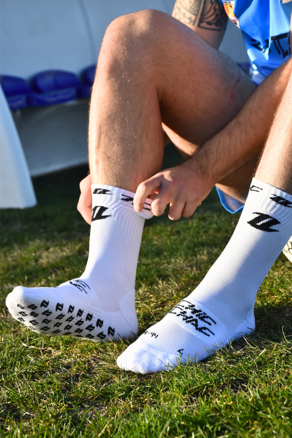 Chaussettes rugby grip blanches portées maintien optimal